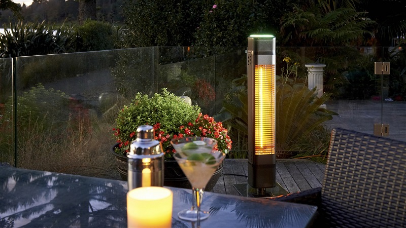 freestanding heater next to the table in the patio